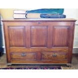 A Georgian style oak mule chest, the rectangular top with moulded edge over a panelled front, and