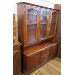 A reproduction side cabinet, with three glazed doors over two drawers and two cupboards, 136cm wide