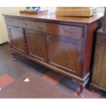 A 1920's mahogany sideboard, the rectangular top with beaded edge over two frieze drawers and