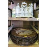 A silver plated condiment stand with eight bottles, three German steins, a water jug, a Halma camera