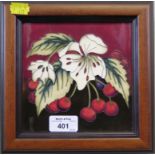 A Moorcroft wall plaque depicting cherries, impressed marks dated 2010, 15cm square