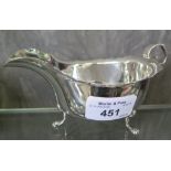 A Chester hallmarked silver sauce boat on three feet