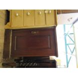 An Edwardian walnut bedside cabinet, with panelled door and plinth base, 42cm wide