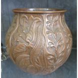 An Arts & Crafts copper planter by John Pearson, of bulbous form with repousse floral and foliate