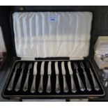 A cased set of cake knives and forks with silver handles