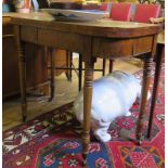 An early 19th century mahogany foldover card table, on ring turned tapering legs, 91cm wide