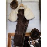 A white fur shawl, a fur stole and two fur hats