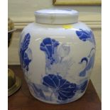 A pair of blue and white ginger jars, decorated with ducks (one cover damaged), 22cm high (2)