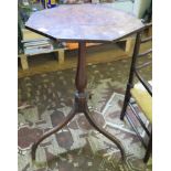 A 19th century mahogany tripod table, the octagonal top on a baluster stem on downswept legs, a.