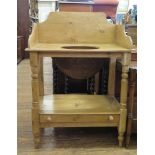 A Victorian pine washstand, the raised three quater gallery over an aperture top on turned