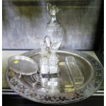 A silver plated four piece condiment set with stand, together with a large circular tray,