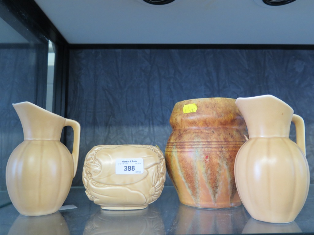 A Beswick brown glazed vase, a pair of jugs and a Sylvac floral design pot (4)