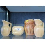 A Beswick brown glazed vase, a pair of jugs and a Sylvac floral design pot (4)