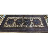 A Belouch tribal rug, with four door design medallions on an ivory ground within a multiple