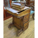 A Victorian burr walnut Davenport with hinged top and slope over four drawers to the side on pad