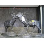 A pair of spelter stags, 29cm high
