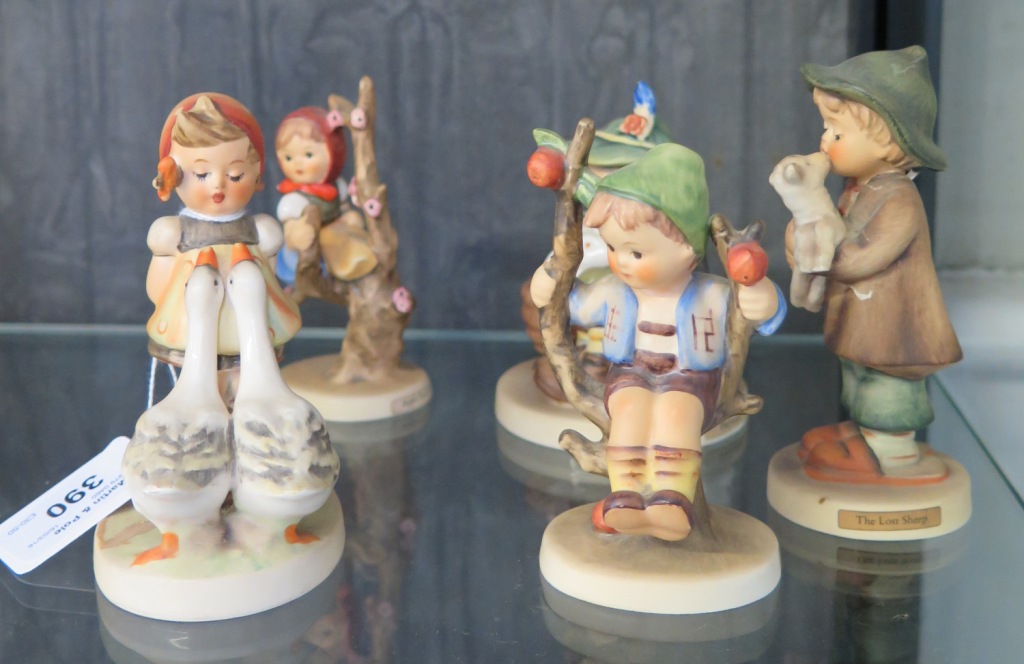 Four Hummel children figures and another (5)