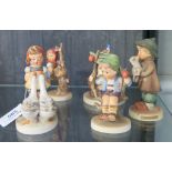 Four Hummel children figures and another (5)