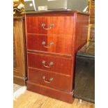 A reproduction mahogany two drawer filing cabinet, with leather inset top and dummy drawer front,