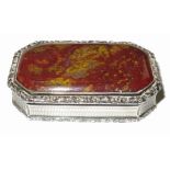 A William IV silver and red agate snuff box, of rectangular form with canted corners, with scroll