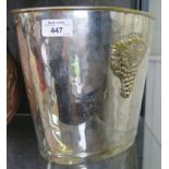 A silver plate ice bucket, of tapering ovoid form with grape motif