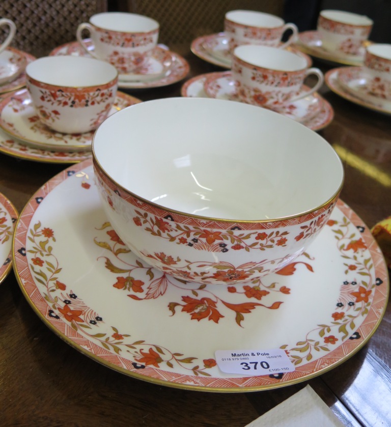 A Wedgwood tea service for ten places, pattern Y64, with red, gold and black floral decoration