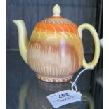 A Shelley teapot, with orange, yellow and brown dripped decoration, 13cm high