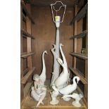 A collection of Lladro and Nao figures of swans, including a table lamp, 46cm high and a Nao