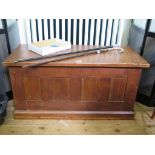 A stained pine panelled blanket box, 104cm wide x 46cm deep x 53cm high