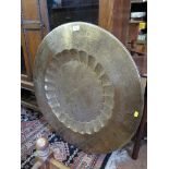 A copper warming pan and an Indian brass tray (2), 76cm diameter