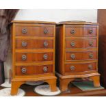 A pair of yew wood veneered serpentine chests of drawers, with four drawers on bracket feet, 41cm