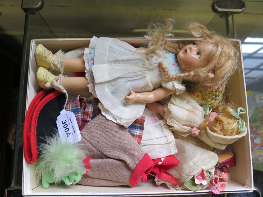A Mme Alexander doll with blonde plait hair, 23cm long, with a collection of costumes, and another