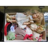 A Mme Alexander doll with blonde plait hair, 23cm long, with a collection of costumes, and another