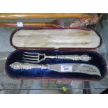 A cased set of plated fish servers with silver handles