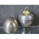 A music box in the form of a silver egg, London 1978, having a rabbit to the interior moving to