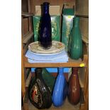 A collection of Courvoisier ceramic display flasks and three Wedgwood plates