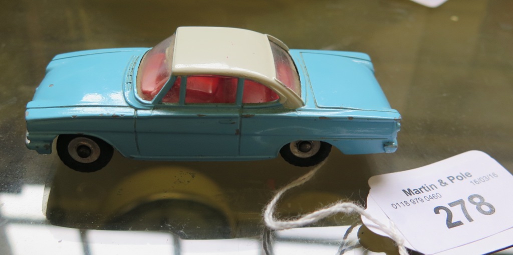 A rare Dinky toy light blue 143 Ford Capri with white roof and red interior, temporary factory