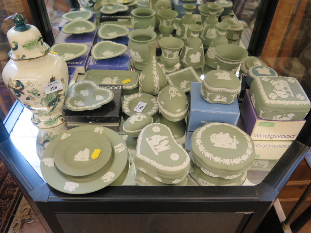 A collection of Wedgwood green Jasperwares, some with boxes and a Masons Chartreuse pattern vase and