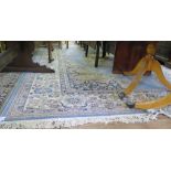 A 'Royal Keshan' blue ground carpet, with ivory medallion and scroll spandrels within an ivory