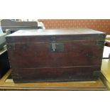 A stained pine chest, with hinged lid and metal corners, 76cm wide