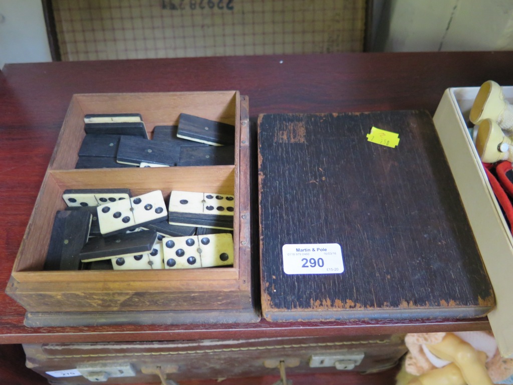 A box of bone and ebony dominoes