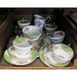 A Paragon tea service for six places, with green ground and floral decoration