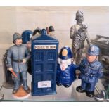 Two novelty policeman teapots and seven other related ornaments