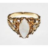 A 10 carat gold ring set with a marquise opal with a single diamond set in a flower head to back