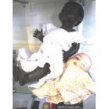 An Armand Marseille porcelain doll head, no.390, and a Pedigree black plastic doll (2)