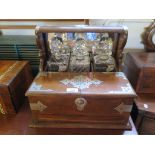 An Edwardian oak and EPNS mounted Tantalus with three square decanters (not matching) over a