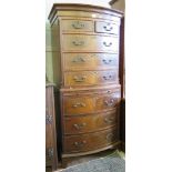 A crossbanded mahogany veneer chest on chest with two short over three long graduated drawers over a