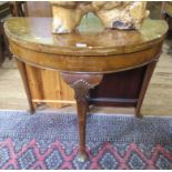 A burr walnut demi-lune card table, with shell carved cabriole legs and club feet, 92cm wide