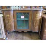 An Edwardian inlaid mahogany display cabinet, the central glazed door flanked by bowed foliate