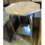 An oak octagonal table with square cabriole legs joined by an under-shelf. 57cm diameter